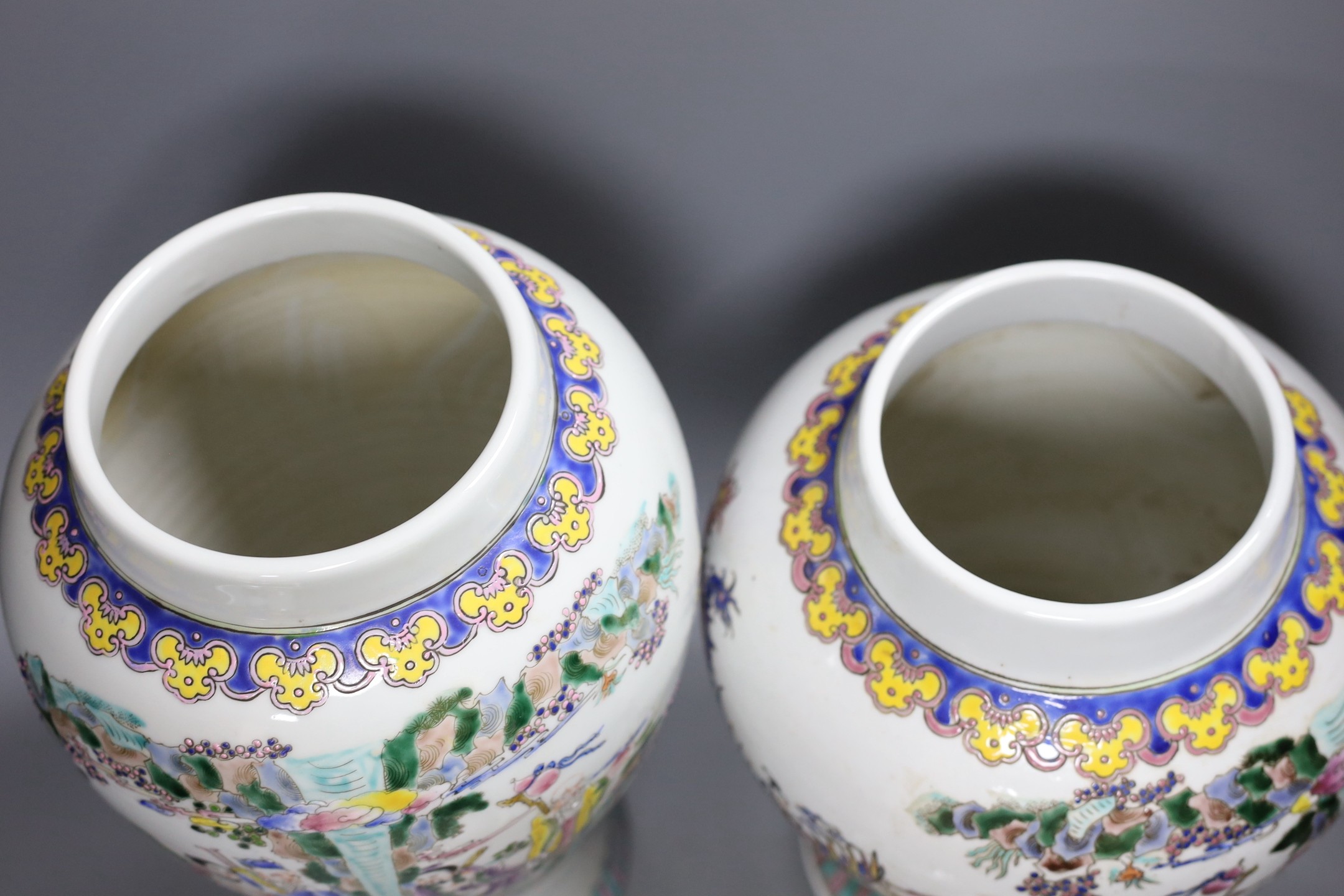 Two Chinese famille rose vases and covers, tallest 46cm high